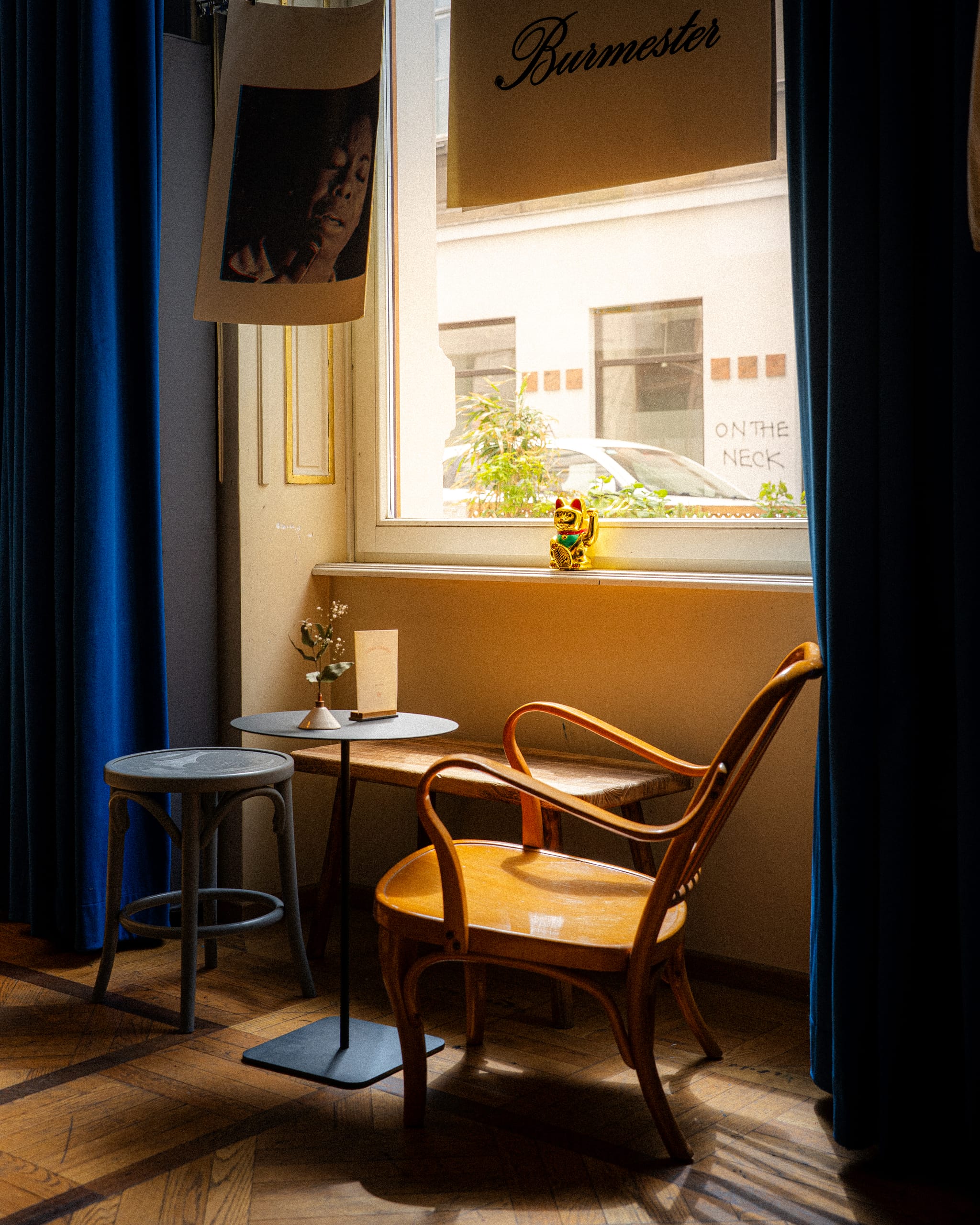 Bentwood chairs by a curtained window