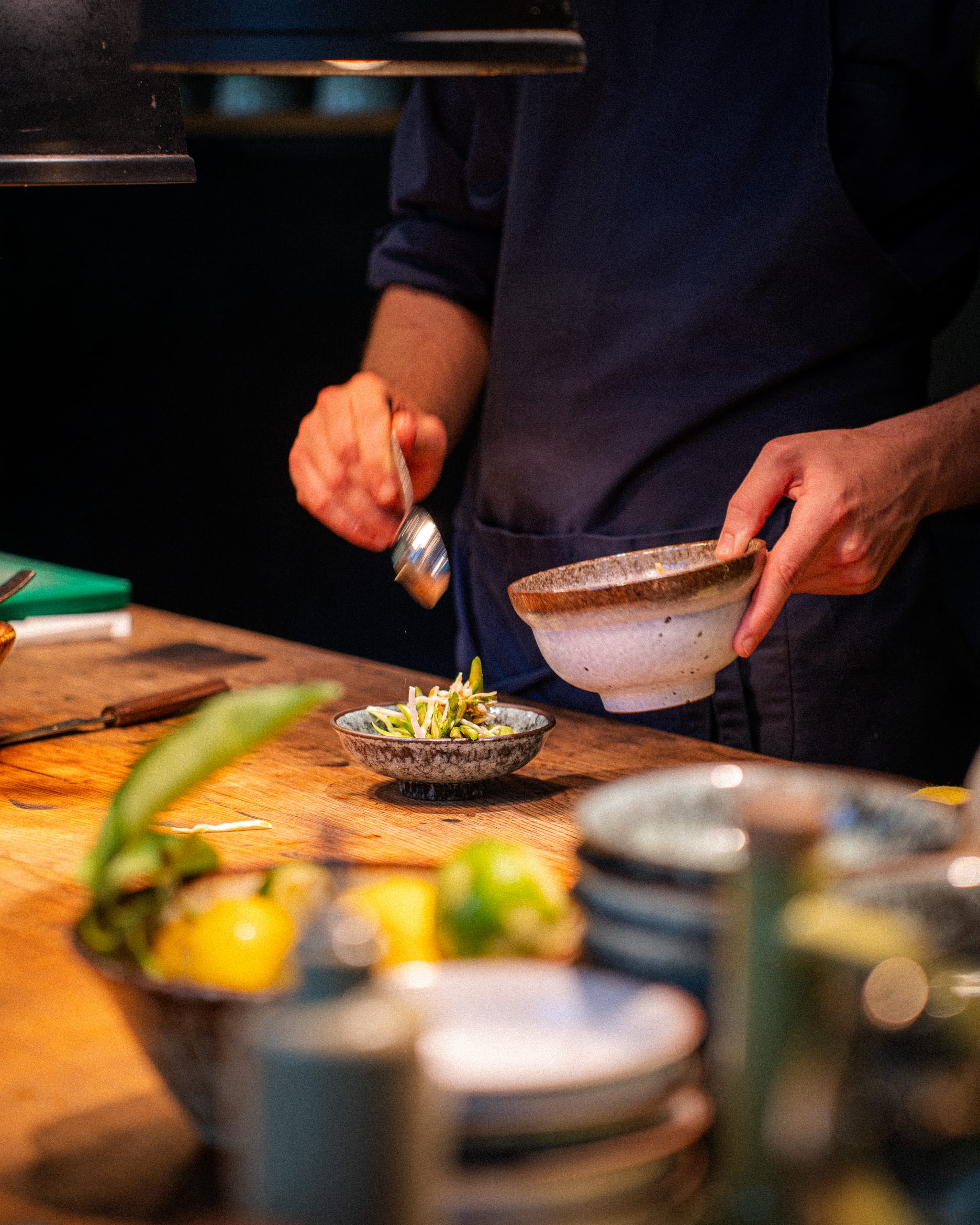 Chef plating at the kitchen counter