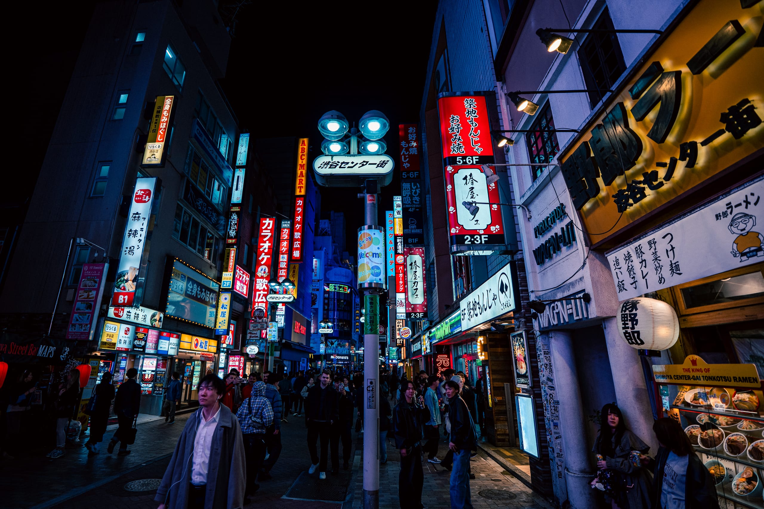 Neon-lit side street in Shinjuku at night
