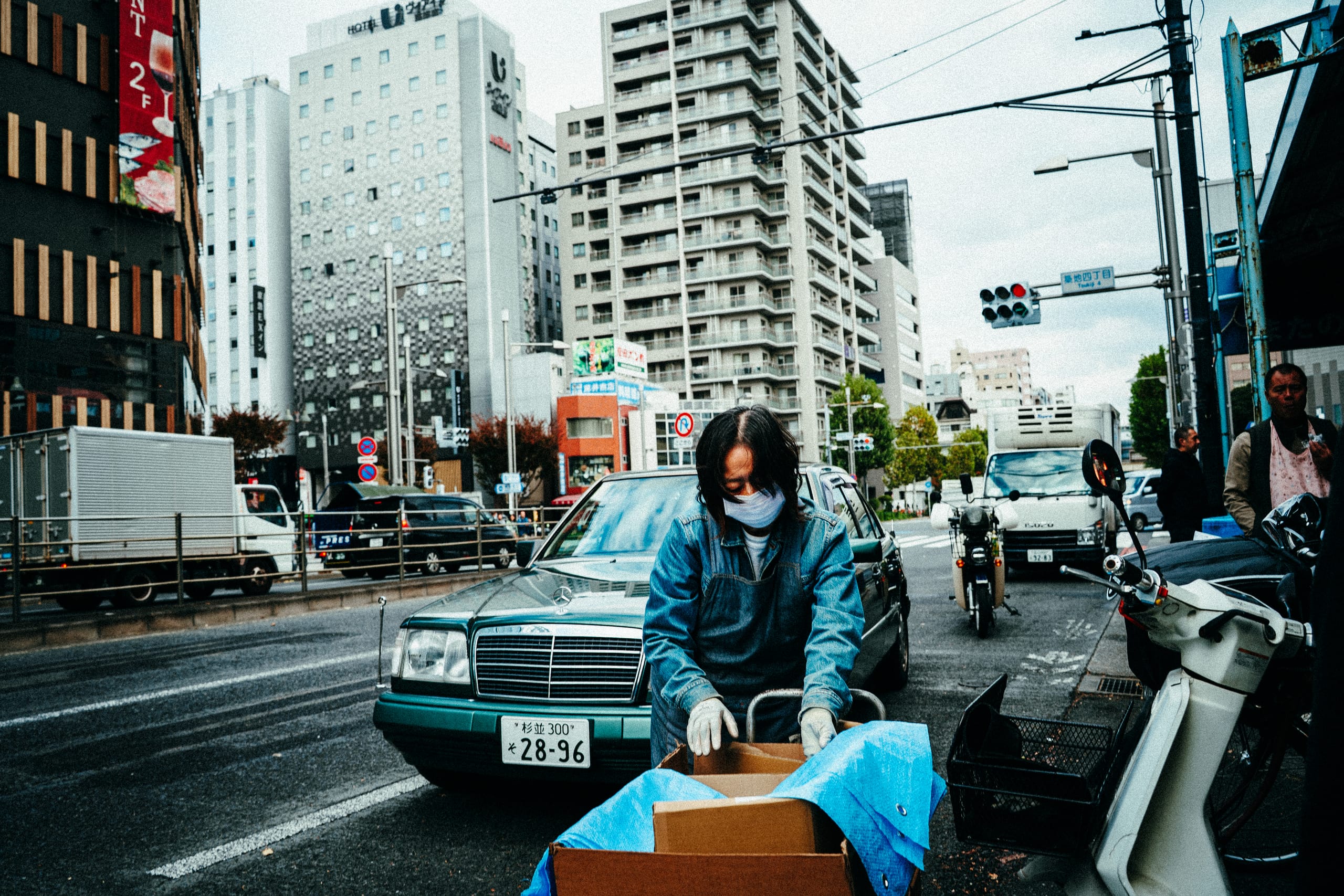 Delivery rider on a scooter in traffic
