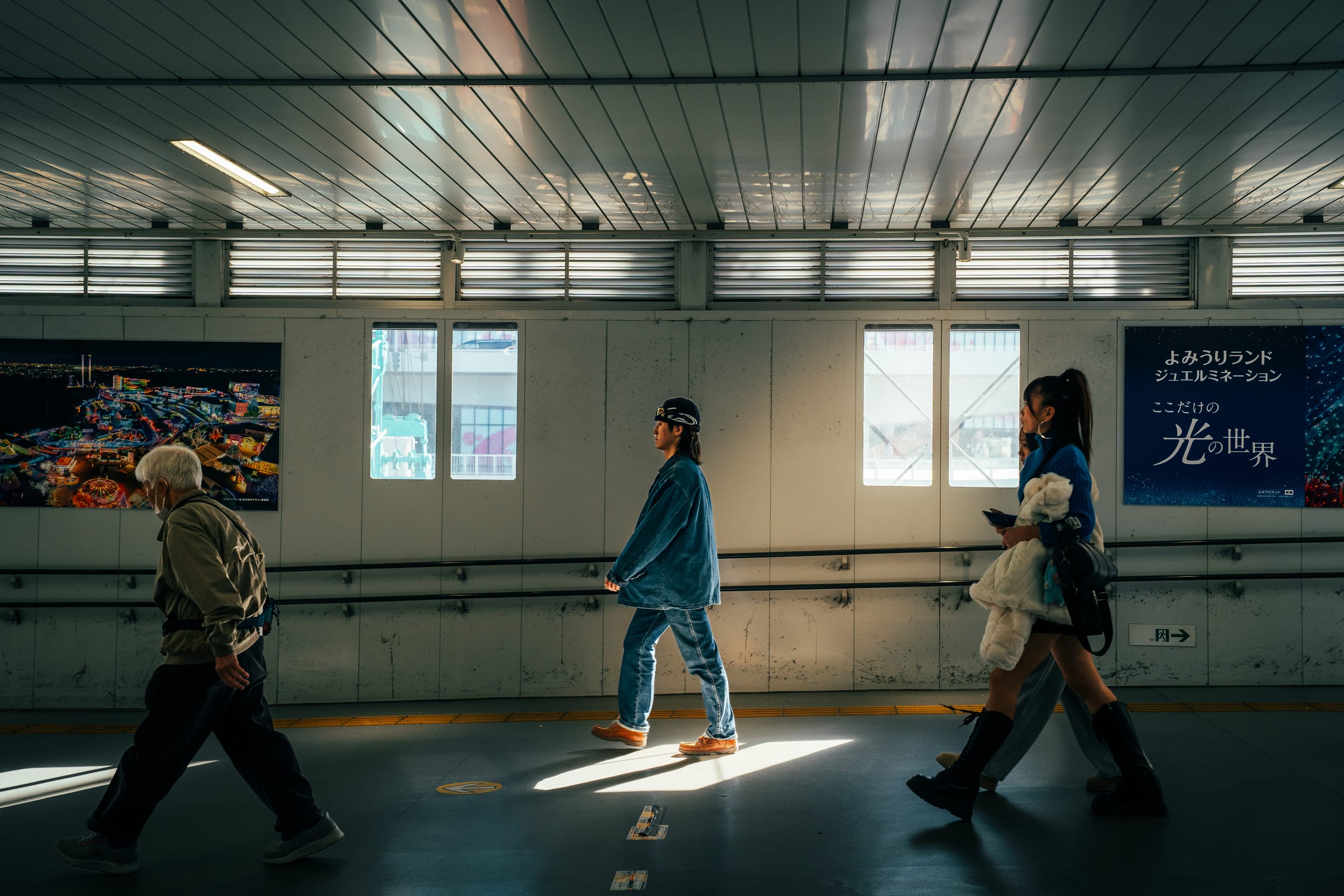 Commuters crossing a station corridor