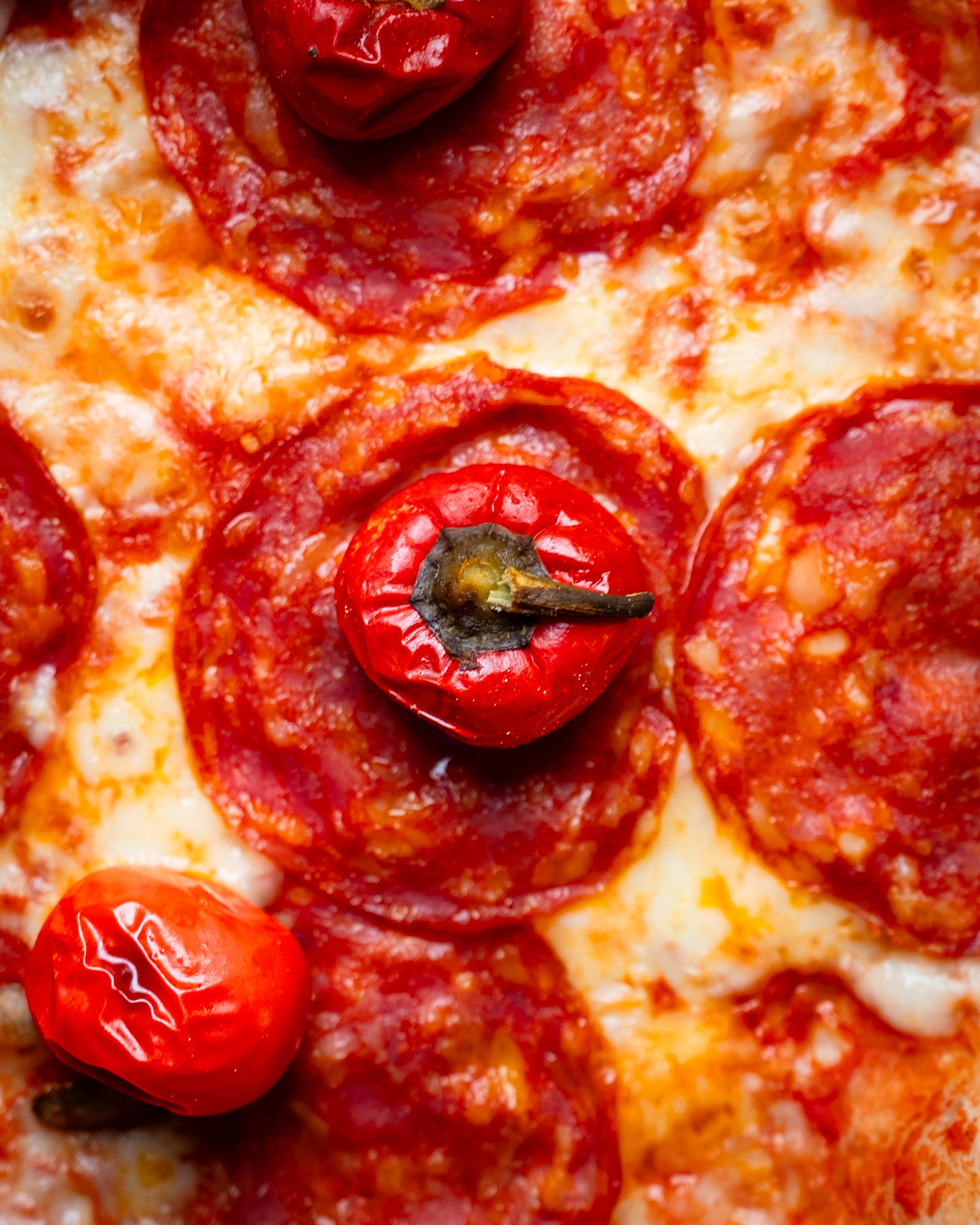 Close-up of pepperoni pizza with chilli