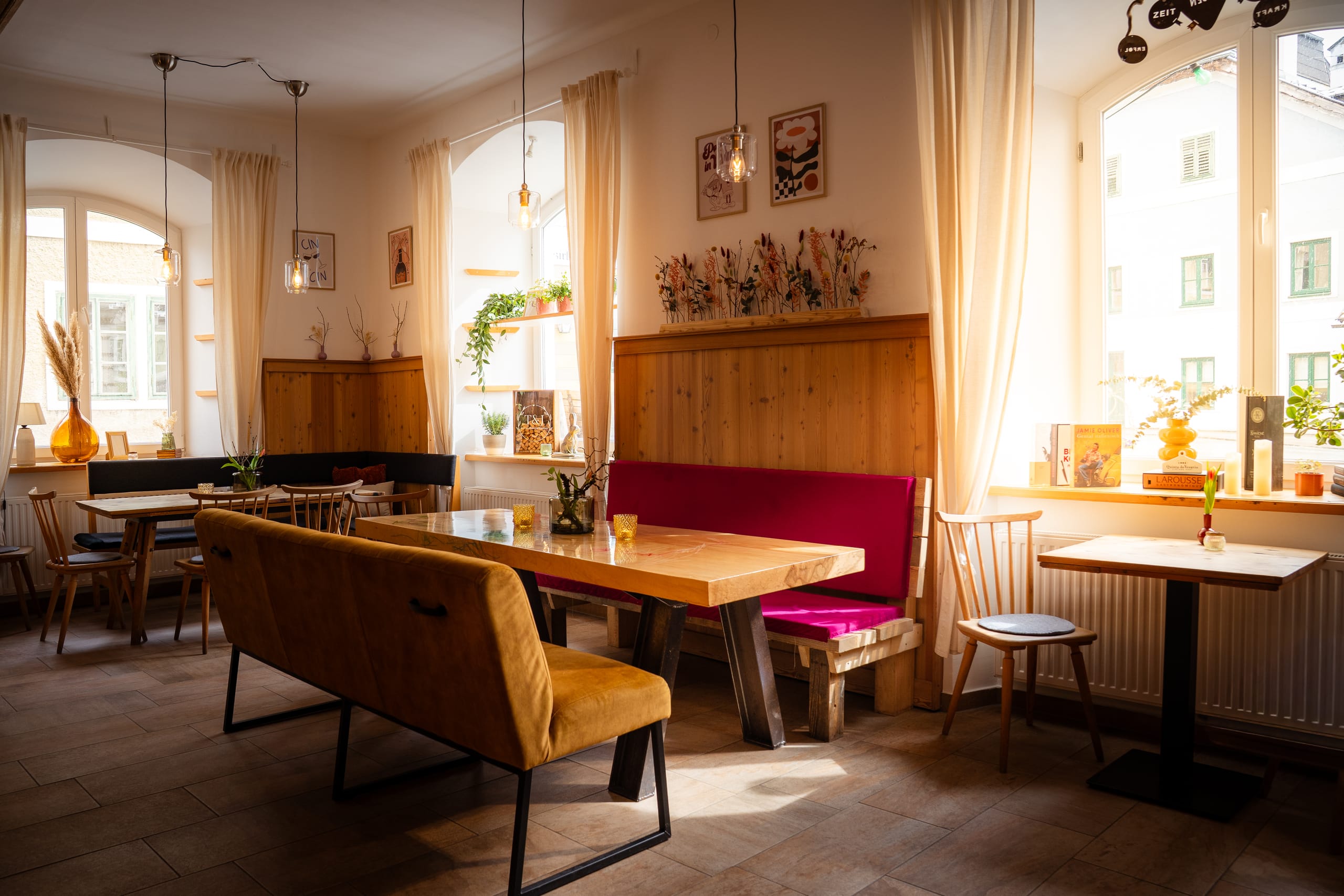 Sunlit dining room with banquettes